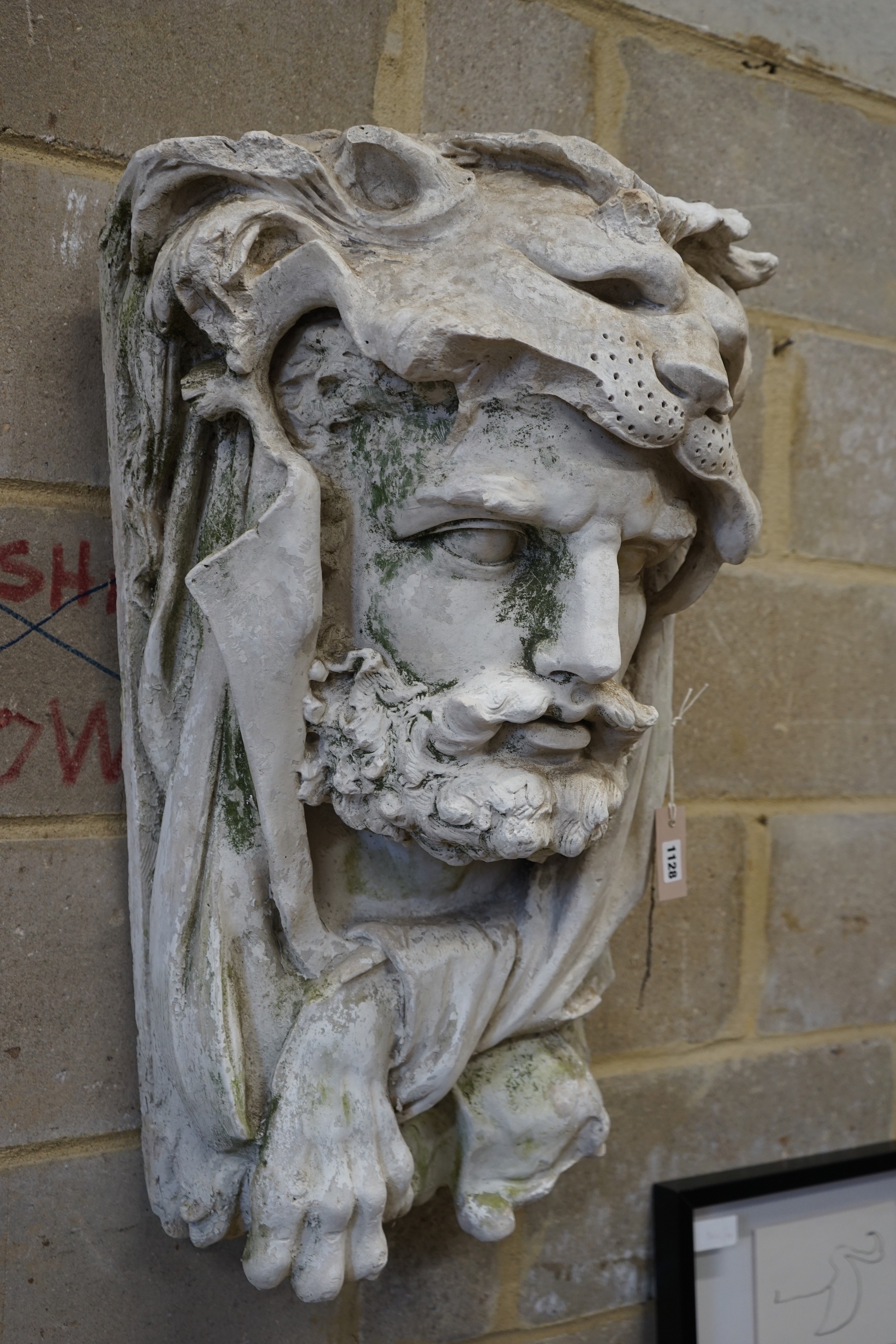 A cast plaster wall mask of Hercules, width 48cm, height 77cm